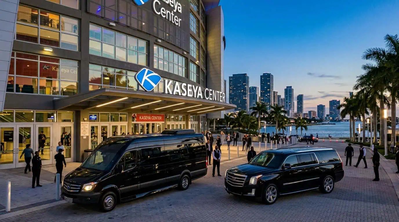 Miami event transportation: a black Sprinter and Escalade staged outside an arena at dusk